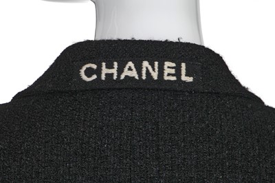 Lot 24 - A Chanel black bouclé wool suit, Autumn-Winter 1995-96
