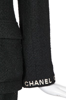 Lot 24 - A Chanel black bouclé wool suit, Autumn-Winter 1995-96