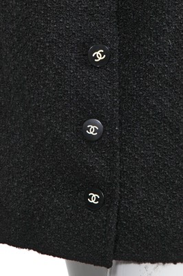 Lot 24 - A Chanel black bouclé wool suit, Autumn-Winter 1995-96