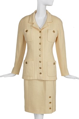 Lot 26 - A Chanel pale yellow bouclé suit, early 1990s