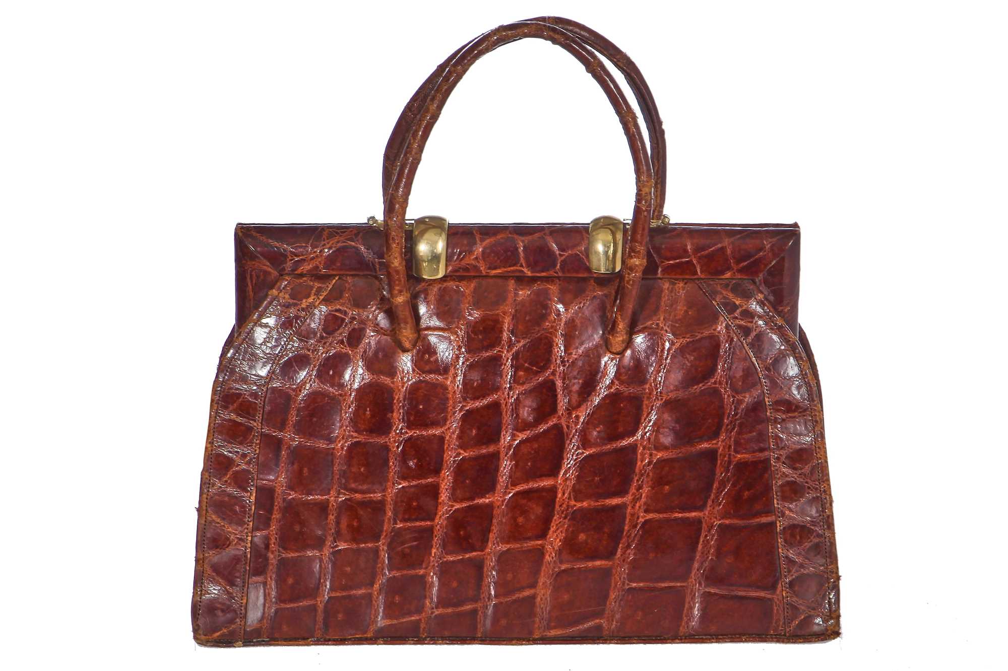 Lot 67 - A brown crocodile handbag, circa 1945 used in the film 'Evita', 1996