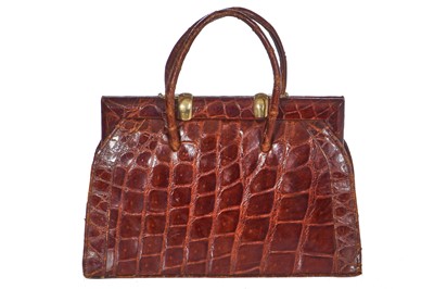 Lot 67 - A brown crocodile handbag, circa 1945 used in the film 'Evita', 1996