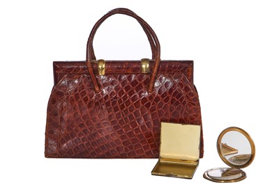 Lot 67 - A brown crocodile handbag, circa 1945 used in the film 'Evita', 1996
