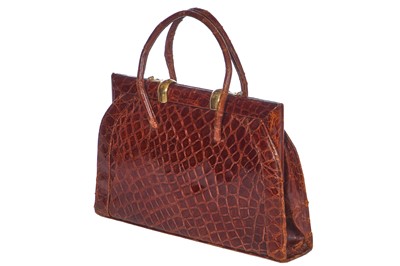 Lot 67 - A brown crocodile handbag, circa 1945 used in the film 'Evita', 1996