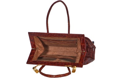 Lot 67 - A brown crocodile handbag, circa 1945 used in the film 'Evita', 1996