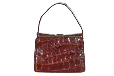 Lot 73 - 'Evita' interest: a brown crocodile handbag, circa 1945 used in the 1996 film