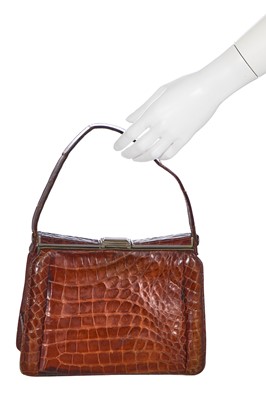 Lot 73 - 'Evita' interest: a brown crocodile handbag, circa 1945 used in the 1996 film
