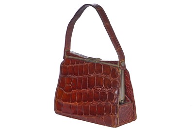 Lot 73 - 'Evita' interest: a brown crocodile handbag, circa 1945 used in the 1996 film