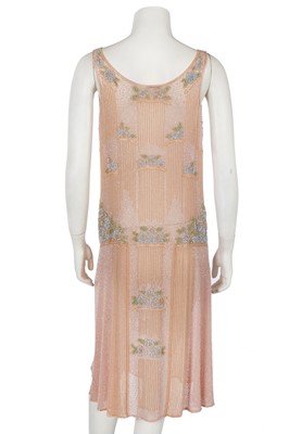 Lot 364 - A beaded peach muslin bridesmaid/flapper dress, circa 1928