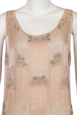 Lot 364 - A beaded peach muslin bridesmaid/flapper dress, circa 1928