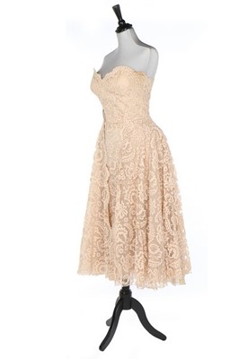 Lot 214 - A Jean Dessès couture peach lace cocktail...