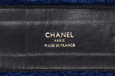 Lot 1 - A Chanel blue and black bouclé tweed jacket, 1989