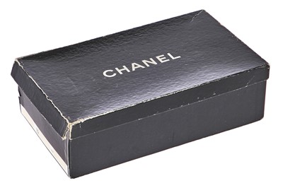Lot 10 - A pair of Chanel shoes and a Chanel hat, late 1980s-early 1990s