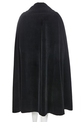 Lot 248 - A Christian Dior London black velvet evening cloak, circa 1970