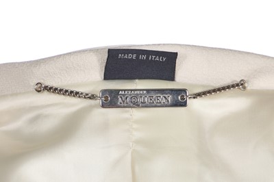 Lot 64 - An Alexander McQueen ivory skirt suit and hat, commercial collection, 2006