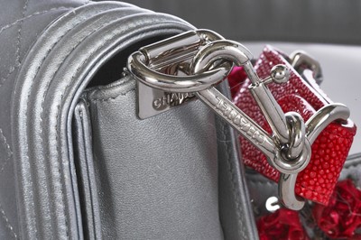 Lot 43 - A Chanel small silver Boy bag with flower strap,  'Paris-Bombay' collection, Métiers d'Art, Pre-Fall 2012