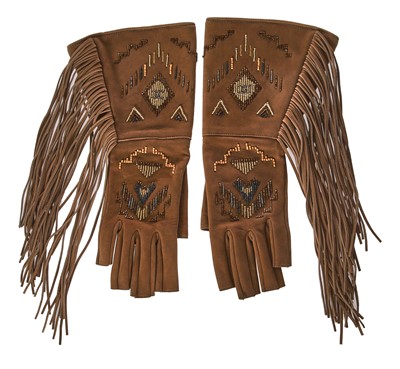 Lot 46 - A pair of Chanel fringed suede gloves, 'Paris-Dallas' collection, Métiers d'Art, Pre-Fall 2014