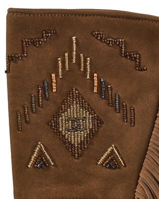 Lot 46 - A pair of Chanel fringed suede gloves, 'Paris-Dallas' collection, Métiers d'Art, Pre-Fall 2014