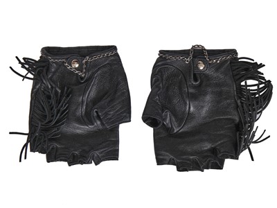 Lot 48 - A pair of Chanel fringed leather motoring gloves, 'Paris-Dallas' collection, Métiers d'Art, Pre-Fall 2014