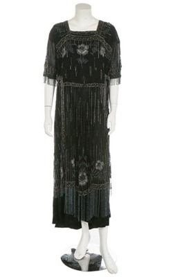 Lot 173 - A beaded tulle tabard, circa 1919, embellished...