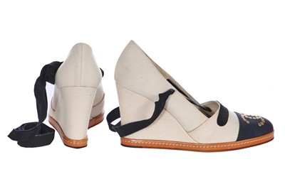 Lot 17 - A pair of Chanel ivory and black canvas wedges, 2010s