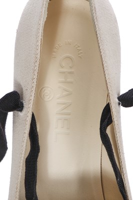Lot 17 - A pair of Chanel ivory and black canvas wedges, 2010s