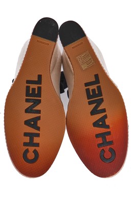 Lot 17 - A pair of Chanel ivory and black canvas wedges, 2010s