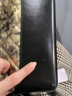 Lot 2 - A Chanel black and gold medium Gabrielle hobo bag, circa 2019