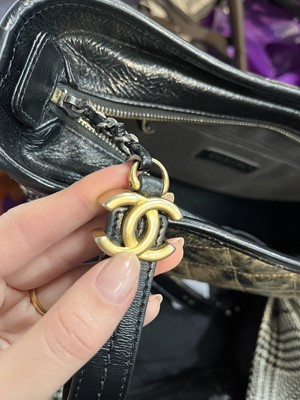 Lot 2 - A Chanel black and gold medium Gabrielle hobo bag, circa 2019