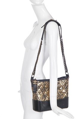 Lot 2 - A Chanel black and gold medium Gabrielle hobo bag, circa 2019