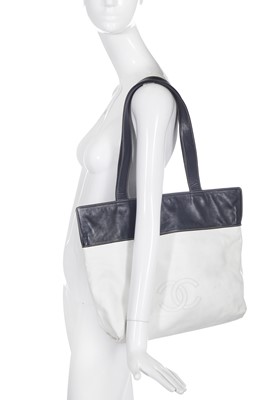 Lot 5 - A Chanel white and navy blue leather shopper tote, 1997-99