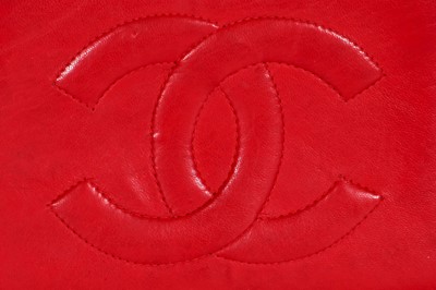 Lot 8 - A Chanel red lambskin trapezoid flap bag, circa 1985
