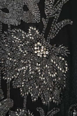 Lot 62 - A beaded chiffon evening coat, 1920s, with...