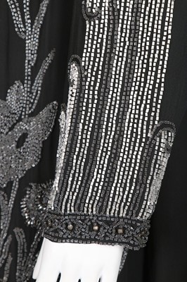 Lot 62 - A beaded chiffon evening coat, 1920s, with...