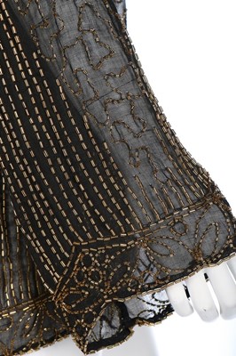 Lot 63 - A beaded jacket, 1920s, the black muslin...
