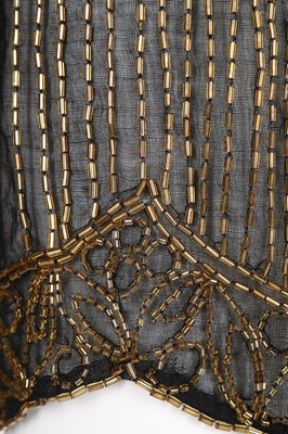 Lot 63 - A beaded jacket, 1920s, the black muslin...