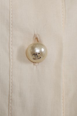 Lot 15 - Two white cotton Chanel blouses, modern