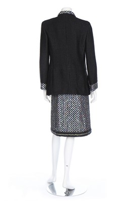 Lot 67 - A Chanel black wool and silver sequinned suit,...