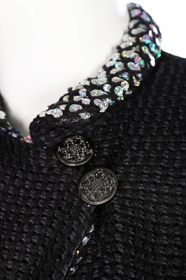 Lot 67 - A Chanel black wool and silver sequinned suit,...