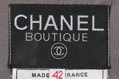 Lot 68 - A Chanel grey and silver tweed jacket, 1994,...