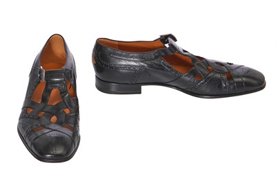 Lot 22 - A pair of Gucci by Alessandro Michelle men's black leather 'cutout' brogues, Autumn-Winter 2017-18