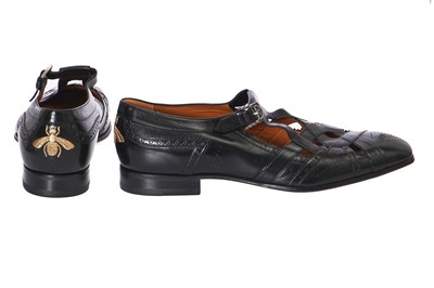 Lot 22 - A pair of Gucci by Alessandro Michelle men's black leather 'cutout' brogues, Autumn-Winter 2017-18
