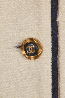 Lot 13 - A Chanel cream wool blend bouclé suit, Spring-Summer 1994