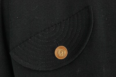 Lot 15 - A Chanel black wool suit, mid-1980s