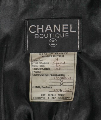 Lot 15 - A Chanel black wool suit, mid-1980s