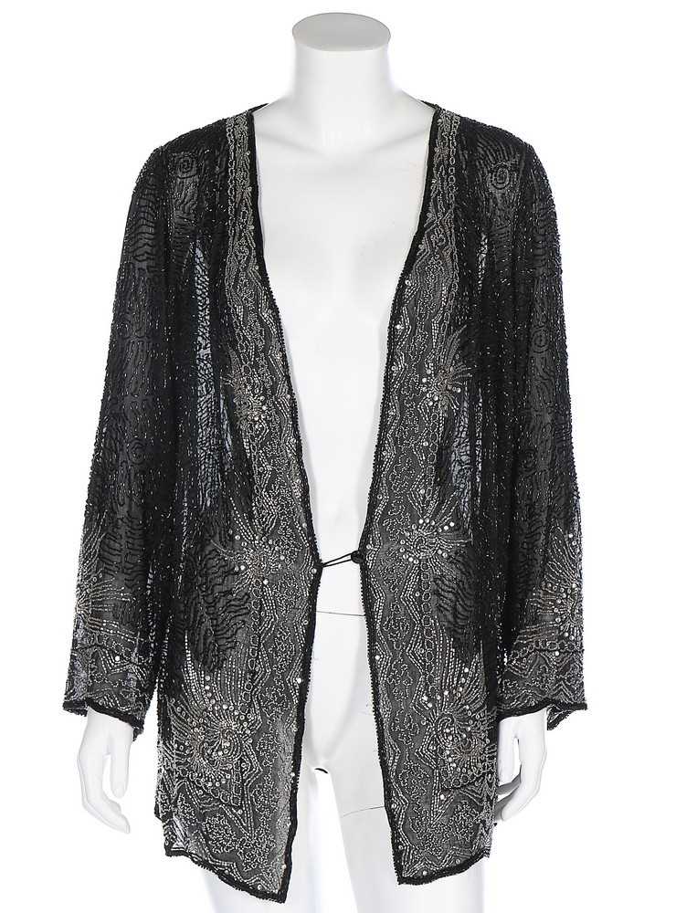 Lot 82 - A silver and black bugle beaded muslin jacket,...