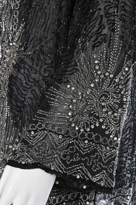 Lot 82 - A silver and black bugle beaded muslin jacket,...