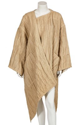Lot 144 - An Issey Miyake crinkle textured tan linen coat, Autumn-Winter 1984-85