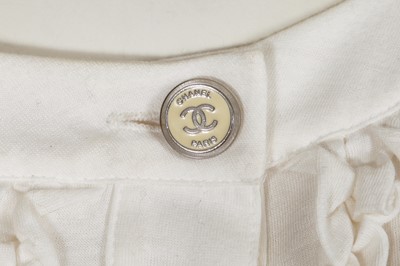 Lot 21 - A Chanel denim jacket and cotton top, Cruise 2009