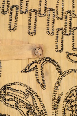 Lot 85 - An Adair beaded yellow silk flapper dress,...